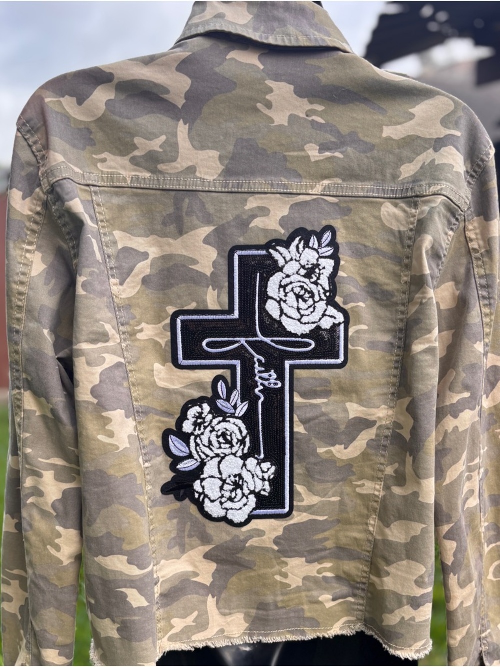 Baccini Camo Jean Jacket with Black & White Floral Cross Patch